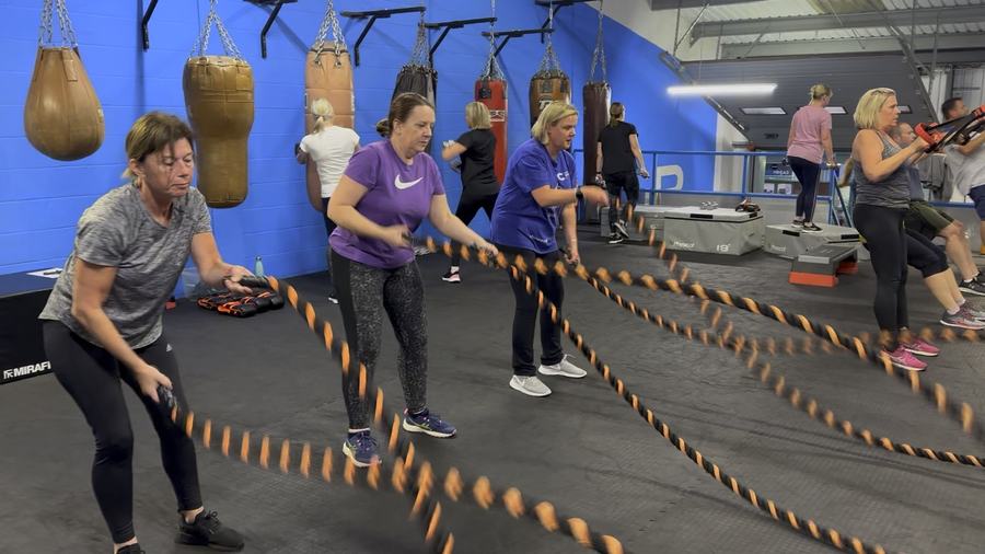 Members doing a battle rope workout in a small group class at Unique Results, Chelmsford